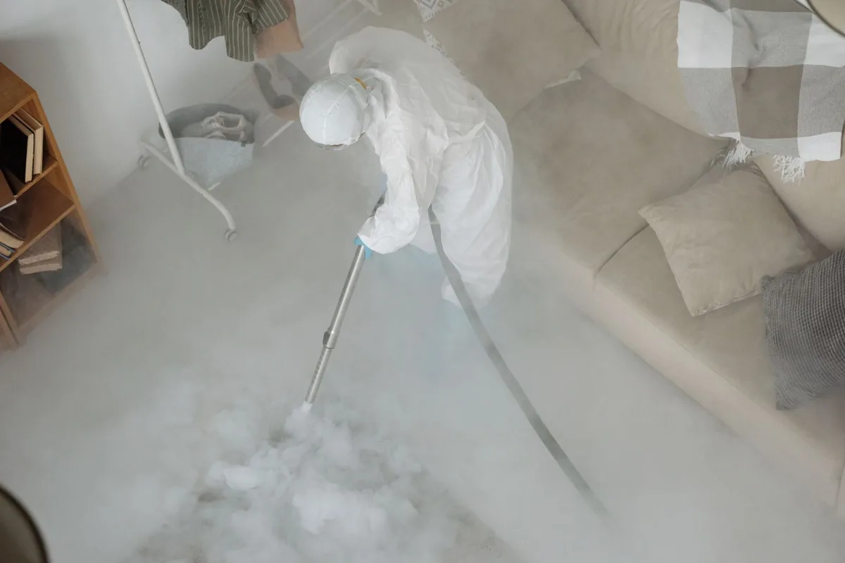 Biohazard cleanup technician in protective equipment, Beattyville, KY